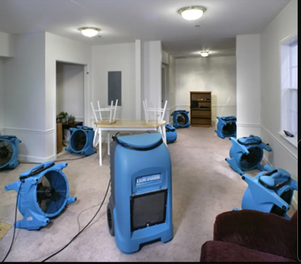 Air movers and dehumidifier setup for Water Damage Restoration in Millington